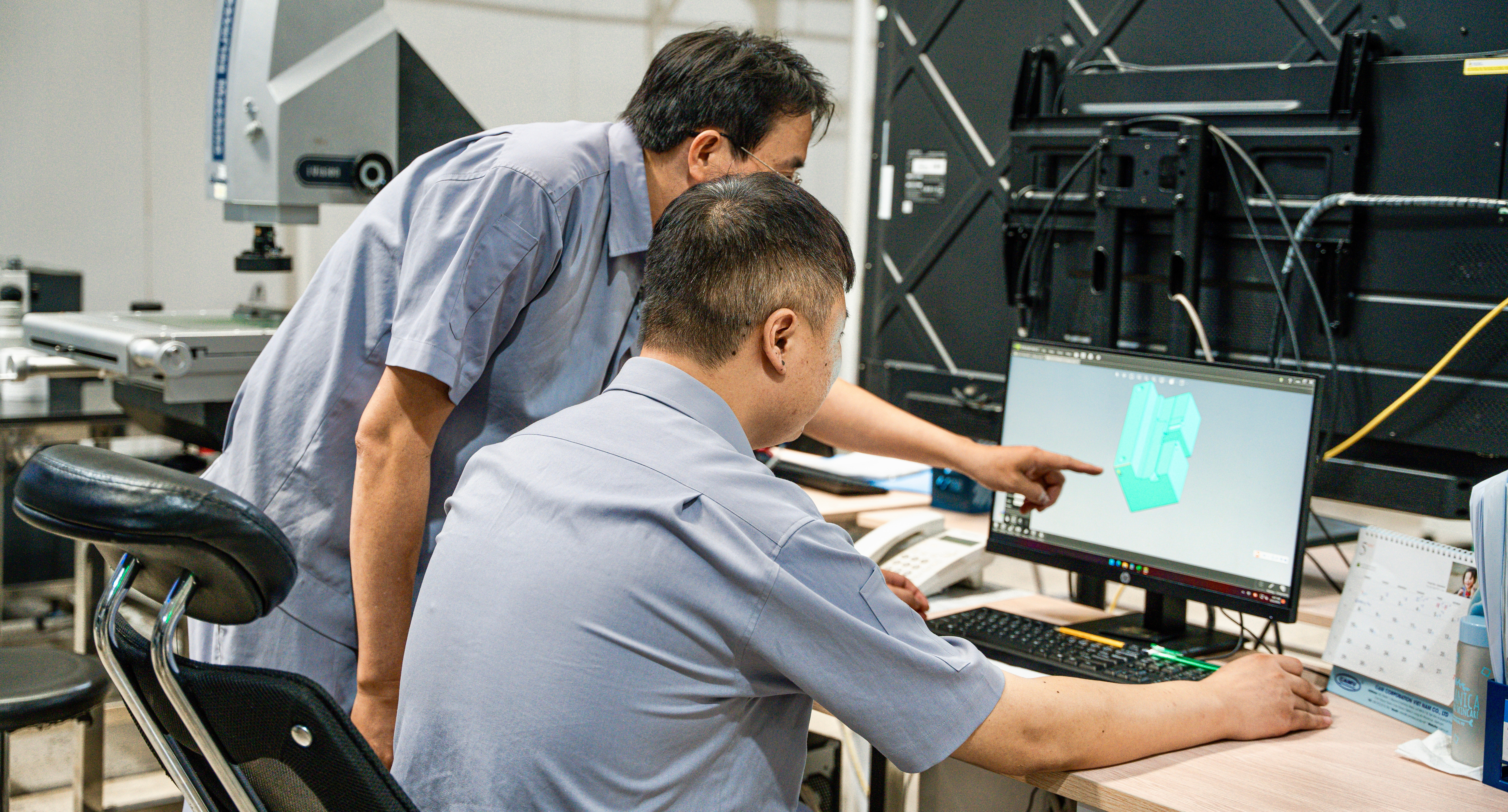 CAM Resources technicians reviewing the mold design
