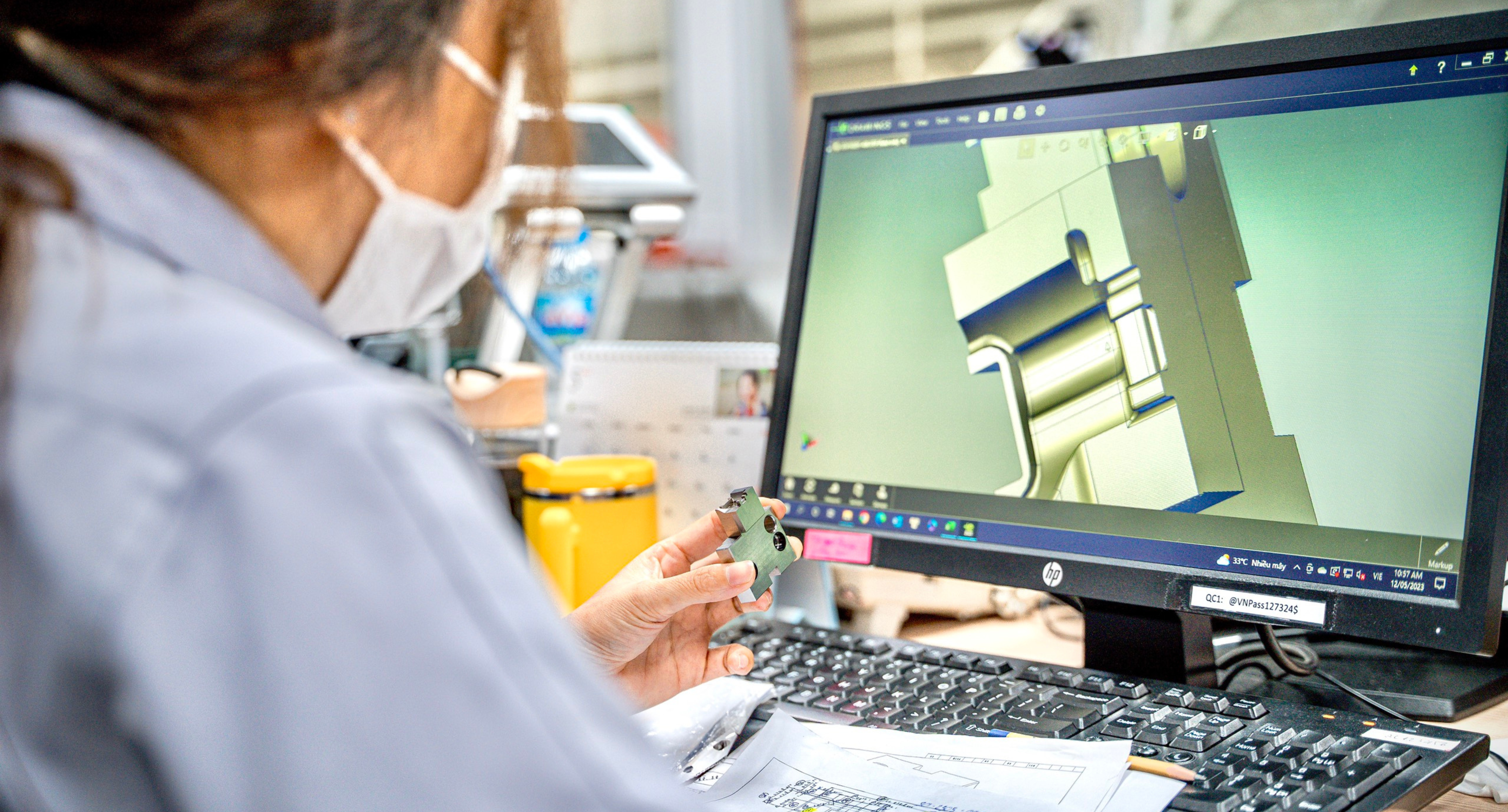  CAM Resources QC Technician checking the mold component against the CAD design